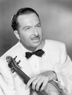 Original caption: Picture shows Xavier Cugat, he became known as the "Rhumba King," and he and his famous band were greatly responsible for the popularity of the "Rhumba," "Samba" and the "Conga." Undated photo circa 1940s-50s. --- Image by © Underwood & Underwood/Corbis