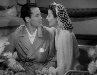 Barbara Stanwyck with Henry Fonda in "The Lady Eve" (1941) wearing a snood.