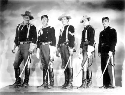  John Wayne, Harry Carey Jr., Ben Johnson, John Agar and George O'Brien on the set of "She Wore a Yellow Ribbon". 