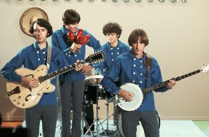 The Monkees performing, and Davy with a ton of maracas. 