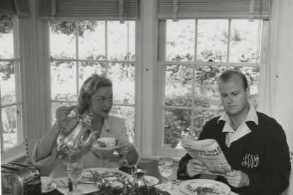 Newly weds child star Bonita Granville and producer husband Jack Wrather at the breakfast table 