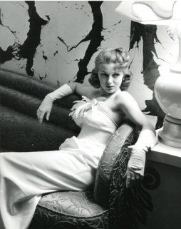 On the nightclub scene in a white evening gown in the 1940s.