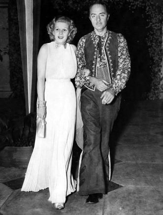 Harlow with fiance William Powell at William Randolph Hearst's birthday party in 1936