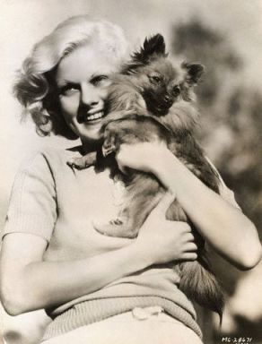 Jean Harlow hugging her Pomeranian, Oscar