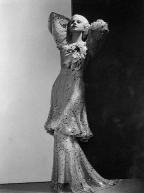 Harlow in 1933. A gold and sequined gown with an Oriental influence 