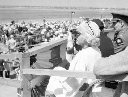 Watching the National Air Races of Los Angeles Municipal Airport in 1933. She raised the flag tobegin the races.