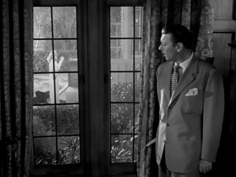Reporter George Brent investigates a murder in "A Corpse Came C.O.D." 