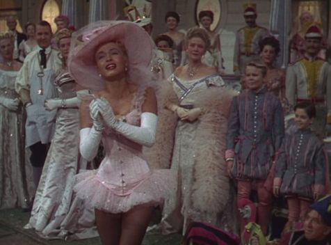 Patti (Powell) dreams of being a grown up lady who wears a corset in this dream sequence. (Comet Over Hollywood/Screen Cap by Jessica P.)