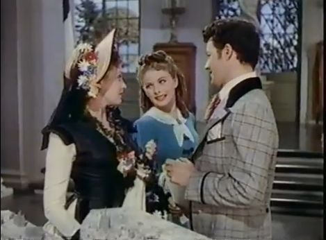 Edith (Darnell) and Julia (Craine) compete for the attentions of Phillippe (Wilde). Comet Over Hollywood/ Screencap by Jessica P.