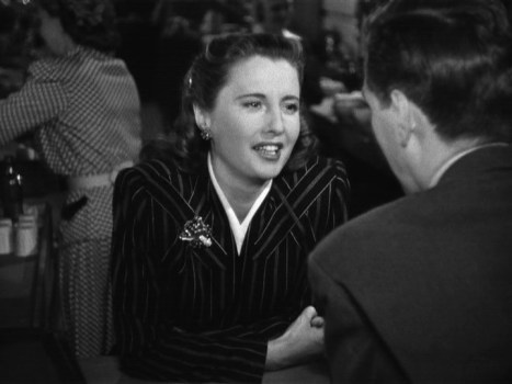 Robert Hutton speaks with Barbara Stanwyck during her cameo.