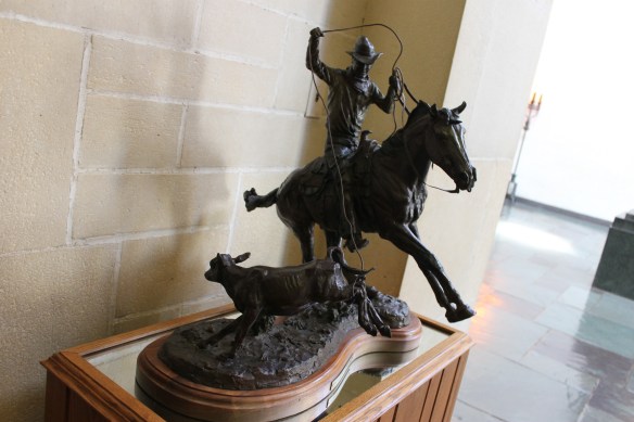 Small sculpture of Rogers roping a calf