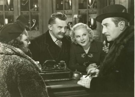 Arline Judge and Adolph Monjou check in to an inn run by Jean Hersholt and Sonja Henie in "One in a Million."