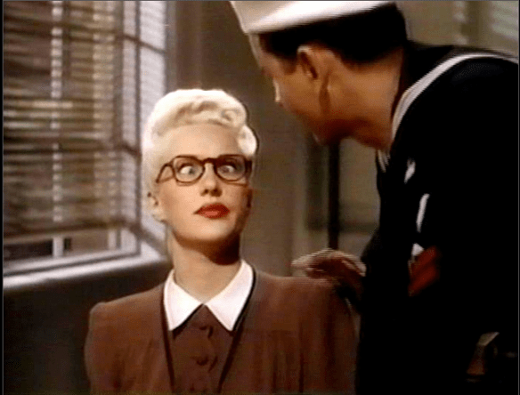 Lorry's disguise- dull colored clothing and glasses.