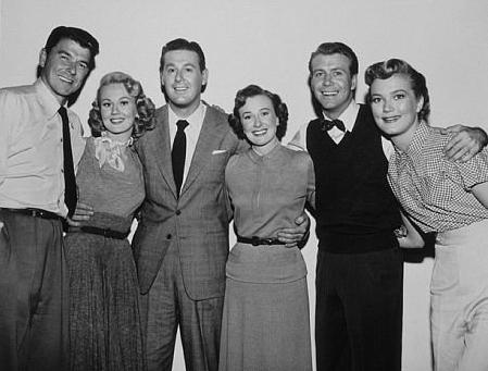 Cast photo of Ronald Reagan, Virginia Mayo, Don DeFore, Phyllis Thaxter, Gene Nelson, Patrice Wymore