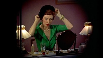 Judith Evelyn plays Miss Lonelyheart. She prepares to go on a date.