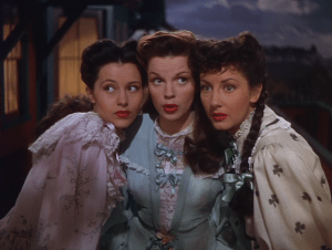 The three female leads: Cyd Charisse, Judy Garland and Virginia O'Brien after singing "It's a Great Big World"