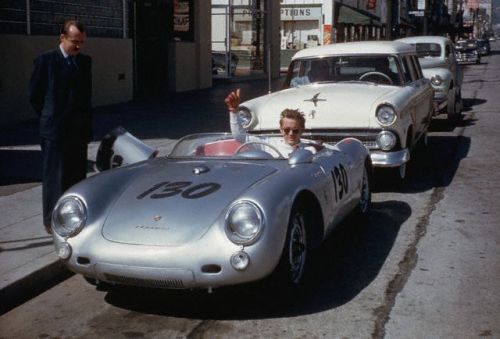 Actor James Dean gives a thumbs-up sign from his Porsche 550 Spyder, the Little Bastard, while parked on Vine Street in Hollywood. Dean, who had taken up racing the year before, owned the car only nine days when he lost his life in a fatal highway accident while driving the Porsche to a Salinas race. 