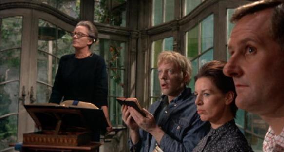 Mrs. Trefoile holds Sunday service at her home with her servants. (Bankhead, Donald Sutherland, Yootha Joyce, Peter Vaughan)