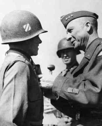 Murphy awarded for valor in 1945. Original caption: 1945-Europe: ANOTHER MEDAL FOR MOST DECORATED AMERICAN SOLDIER. General Alexander Patch of the U.S. 7th Army decorates Lt. Audie Murphy of Farmersville, Texas with the Medal of Honor.. Lt. Murphy is the most decorated American soldier, holder of every decoration for bravery save the legion of merit. He rose from the rank of private to become a company commander in 30 months of combat duty with the veteran third division. 