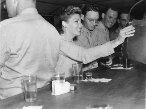 Martha Raye with soldiers in Africa. 