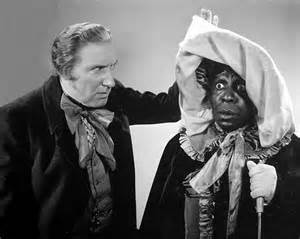 Clarence Muse dresses as Bobby Breen's aunt as he tries to help him escape. This is a publicity photo with Muse and Edwin Maxwell.