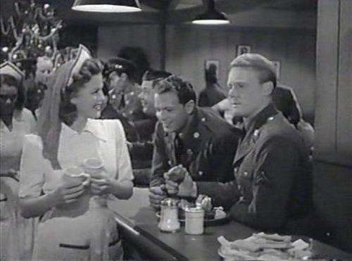 Pat (Jean Rogers) meets Mike (Van Johnson) at the canteen on Christmas Eve. (Comet Over Hollywood/Jessica P)