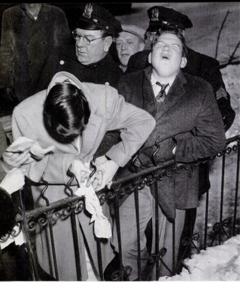 Joseph Gondola with his finger stuck on a fence. Photo by John Crivelli from the Patterson Evening News. (Scan by Comet Over Hollywood