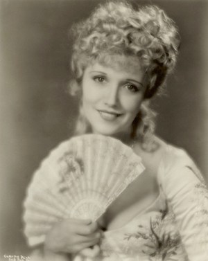 Publicity shot of Claudia Dell dressed in costume as Sweet Kitty Bellair