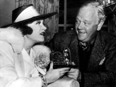 Alice Brady receives her Best Actress in a Supporting Role replacement award from Charles Winniger.