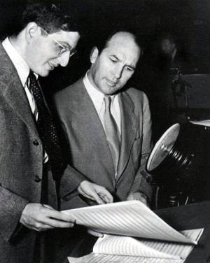 Bernard Herrmann with director William Dieterle looking over the Academy Award winning "All That Money Can Buy" score. 