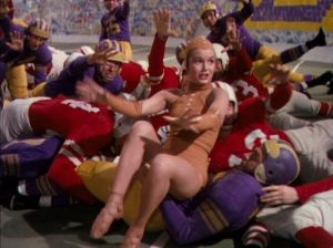 Debbie Reynolds dressed as a football, showing how much she is struggling in her dancing and acting career. 